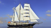 Sailing yacht RUNNING ON WAVES